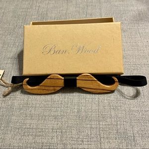 Wooden bow tie shaped like a mustache